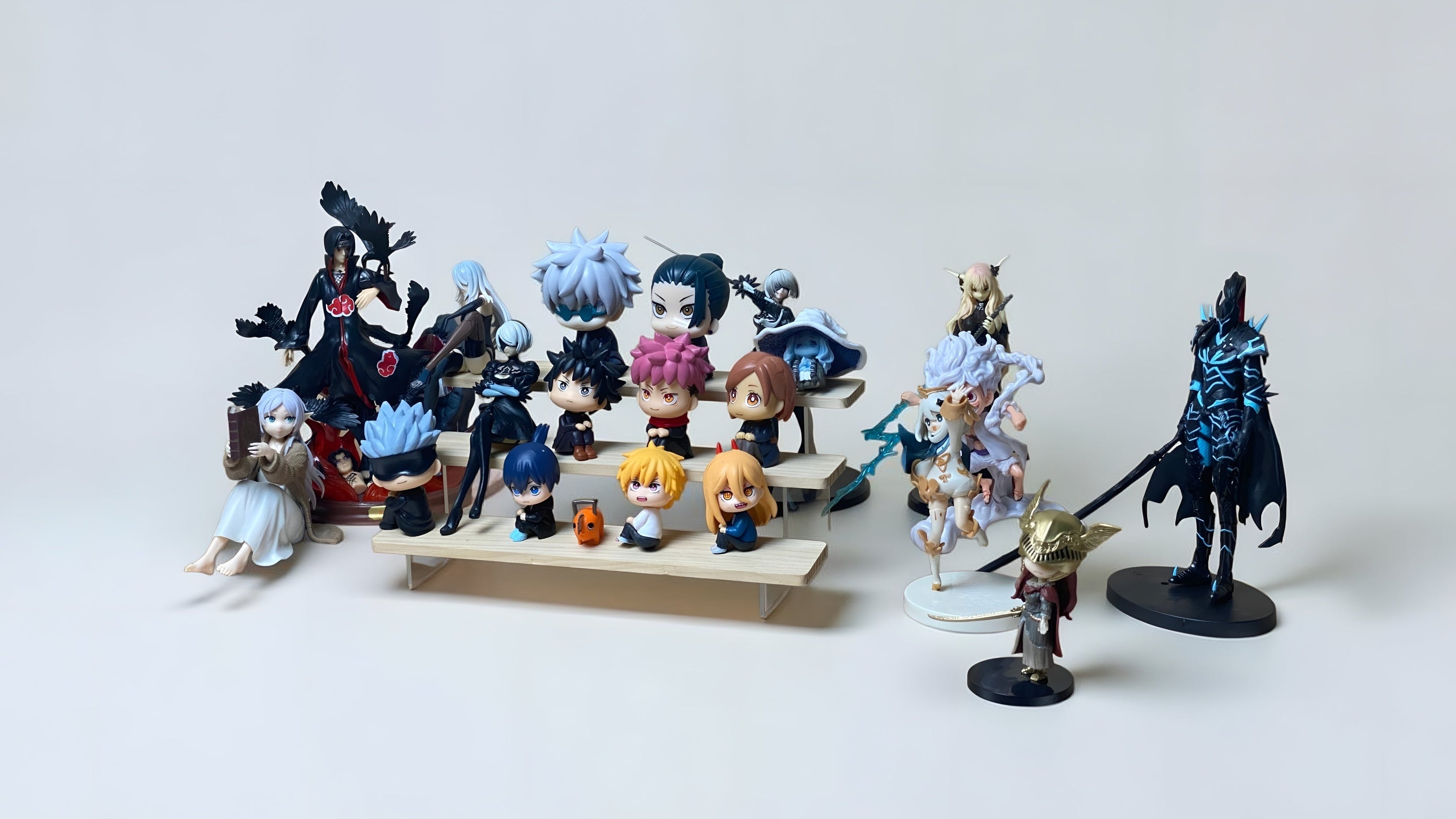 Collection of anime figurines on a white background